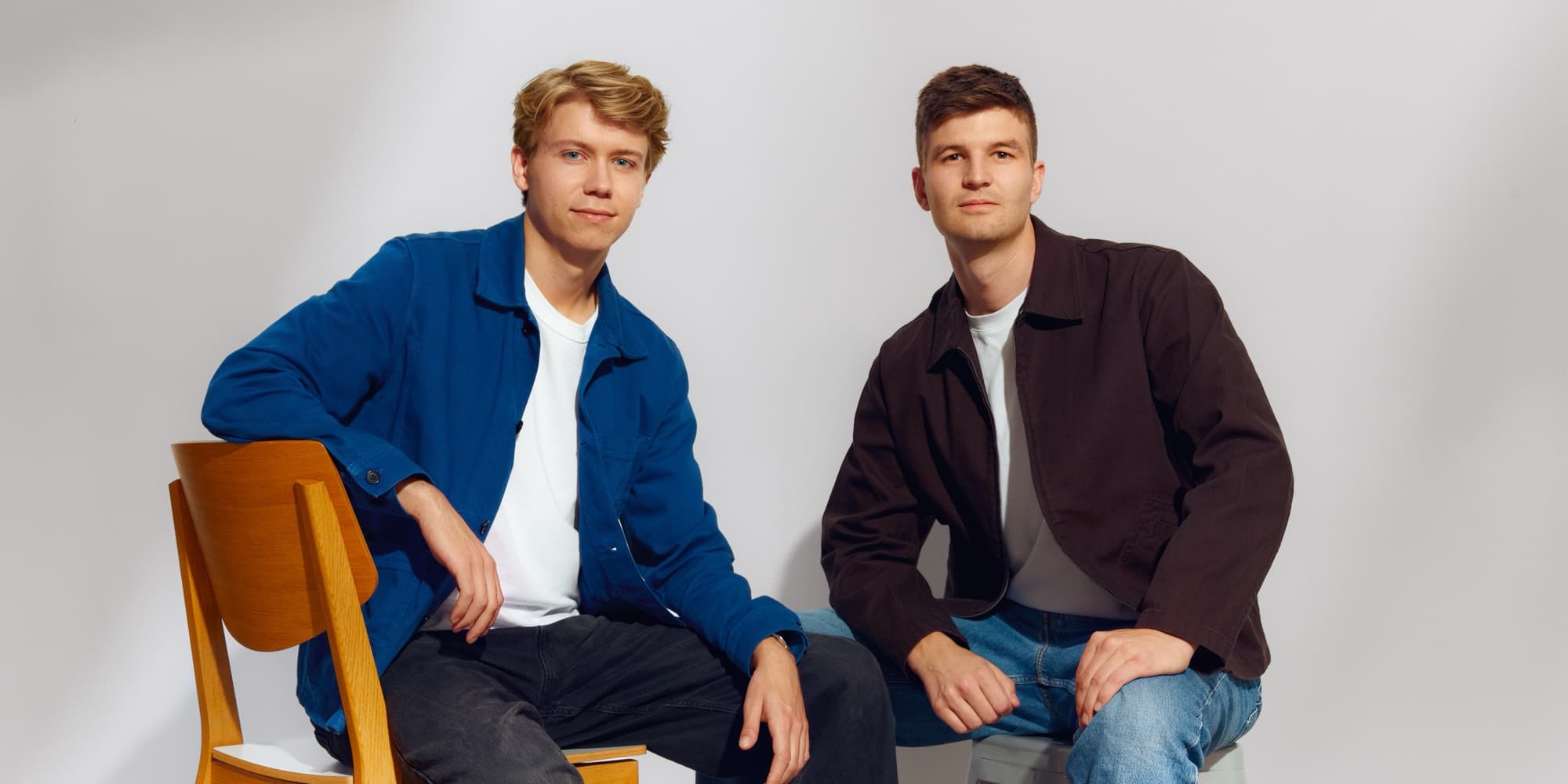 The two Nomos co-founders seated side by side in a studio